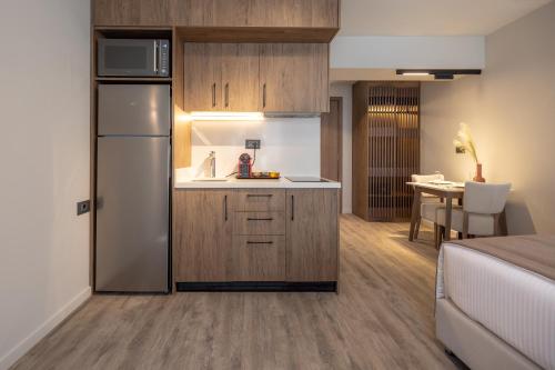 a kitchen with a refrigerator and a table in a room at 507 Athens in Athens