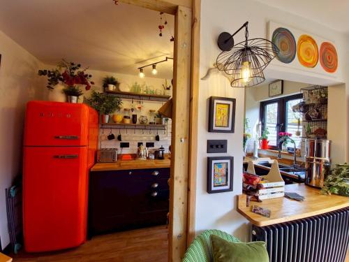a kitchen with a red refrigerator in a room at Pass the Keys Oasis Escape Central Gorgeous in Poole
