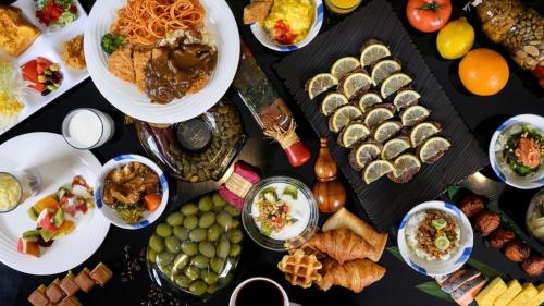 a table topped with lots of different types of food at Hotel Forza Nagasaki in Nagasaki