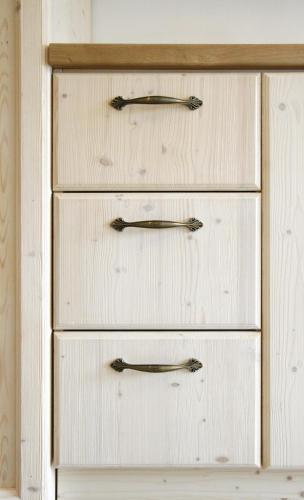 three drawers in a white cabinet with metal handles at Červený Stylový Apartmán 3 km od Malé Skály in Koberovy