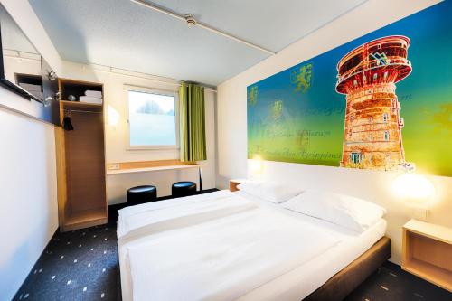 Postelja oz. postelje v sobi nastanitve B&B HOTEL Köln-Frechen