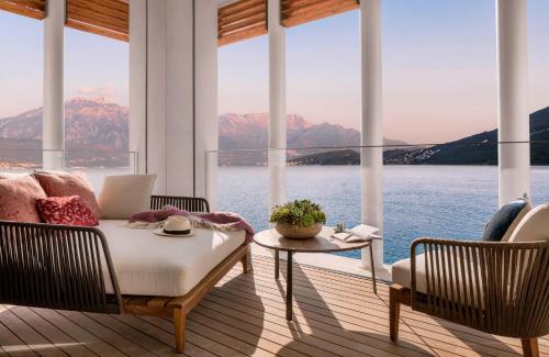 a living room with a view of the water at One&Only Portonovi in Herceg-Novi