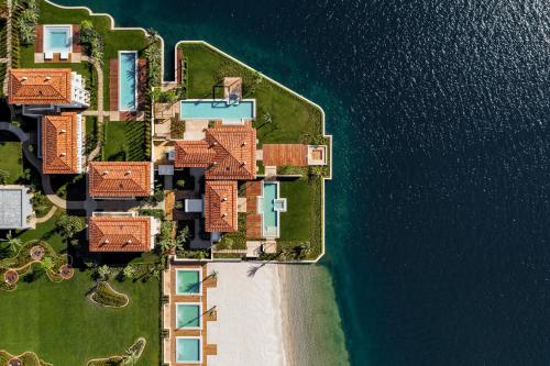 an aerial view of an island in the water at One&Only Portonovi in Herceg-Novi