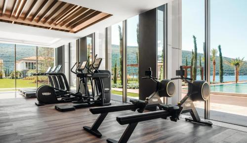 a gym with several treadmills and elliptical machines at One&Only Portonovi in Herceg-Novi