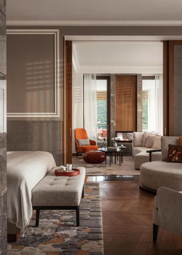 a bedroom with a bed and a living room at One&Only Portonovi in Herceg-Novi