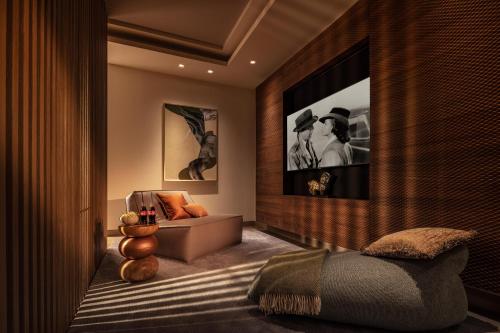 a bedroom with a bed and a couch in a room at One&Only Portonovi in Herceg-Novi