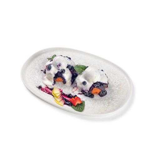 a plate of food on a white plate at Hotel Nordic Twins & Wellness in Rădăuţi