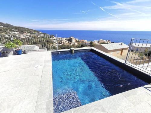 The swimming pool at or close to Villa Turchina- vue imprenable à Erbalunga