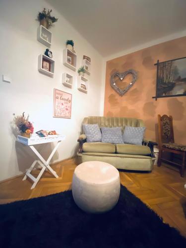 a living room with a couch and a table at Kristínka in Český Krumlov
