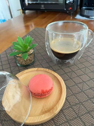 a table with a plate of cookies and a glass bowl at Sand House in Chaweng