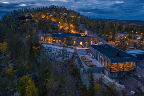 an aerial view of a large building with lights at Lapland View Lodge in Övertorneå