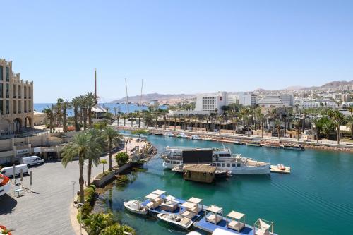 a view of a marina with boats in the water at Lagoona by Isrotel Collection in Eilat
