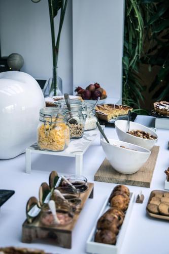 a table topped with lots of different types of food at La Pampa Relais & Spa in Melizzano