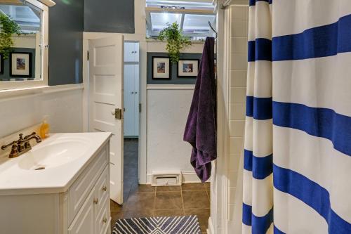 a bathroom with a sink and a shower at Quaint Anderson Home with Sunroom, Walk To Downtown! in Anderson