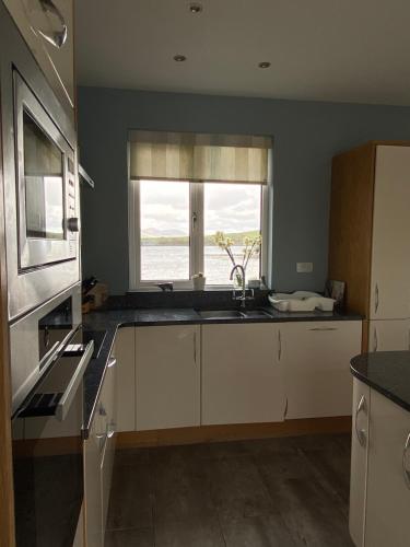 Η κουζίνα ή μικρή κουζίνα στο Seapoint House