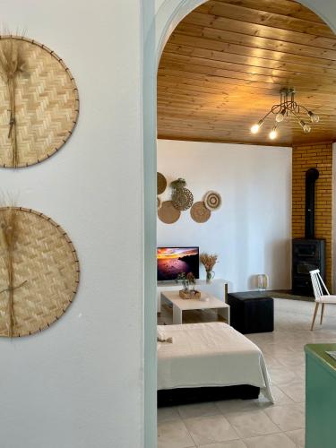 a room with a bed and a living room at The balcony in Glossa