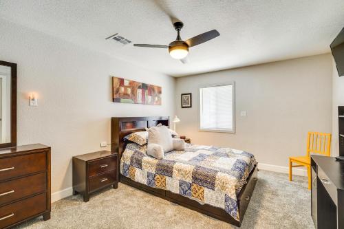 a bedroom with a bed and a ceiling fan at Central Henderson Retreat Near Dining and Lake Mead! in Las Vegas