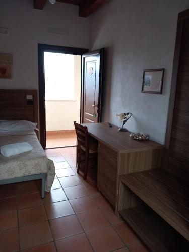 Ένα ή περισσότερα κρεβάτια σε δωμάτιο στο Agriturismo L'Ulivo