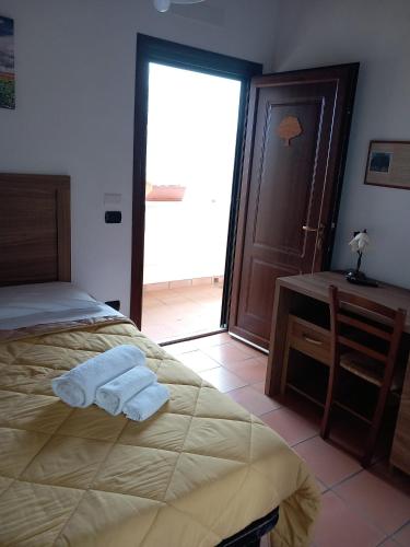 Ένα ή περισσότερα κρεβάτια σε δωμάτιο στο Agriturismo L'Ulivo