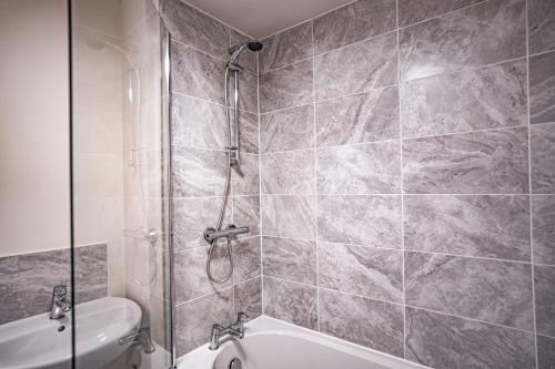 a bathroom with a shower and a toilet at Stunning 2-Bed House in Manchester with canal view in Manchester