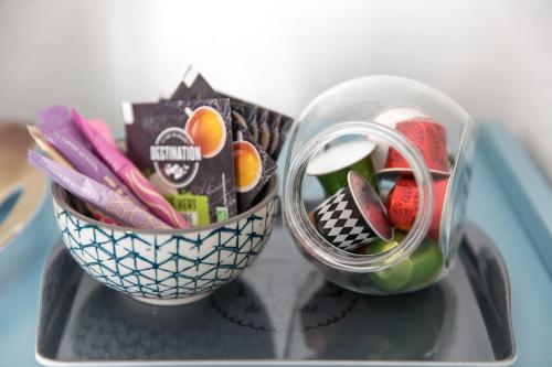 a glass container filled with different types of candy at Auguste, La Romaine et My César - Location Saverne in Saverne