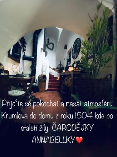 a picture of a room with a clock and a table at Kristínka in Český Krumlov
