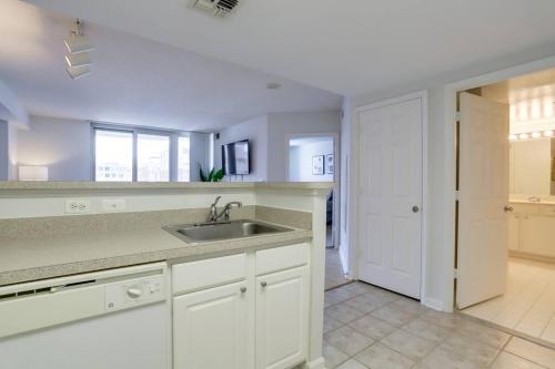 a kitchen with a sink and a counter top at Fantastic 1 Bedroom Condo At Ballston With Gym in Arlington