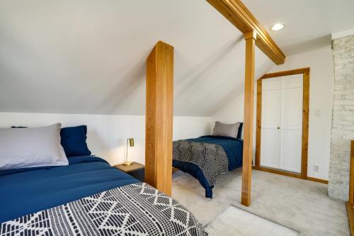 a bedroom with two beds in a attic at Charming and Updated Home in Howe Neighborhood! in Minneapolis