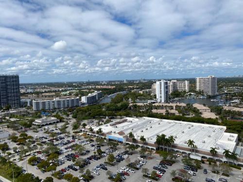 an aerial view of a parking lot in a city at Beachy Vibes Studio, 2 Full Beds, Near Everything -30B in Hallandale Beach