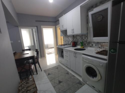a kitchen with a washing machine and a sink at Sweet Home in Historical Area 3B in Istanbul
