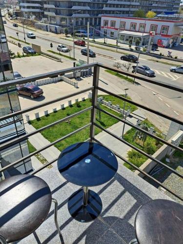 a blue chair sitting on top of a balcony at Mihail apartments in Năvodari