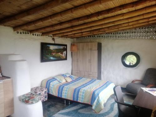 Posteľ alebo postele v izbe v ubytovaní Cabaña MonteNube EcoConcientizate