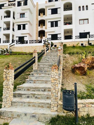 a set of stairs in front of a building at Lilacs Garden Cabo in M'diq