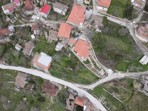 an overhead view of a neighborhood with houses and roads at Peak heaven in Feneos