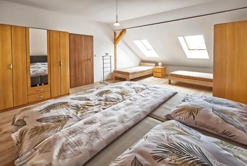 a bedroom with two large beds in it at Nice accommodation in Mikulov in Mikulov