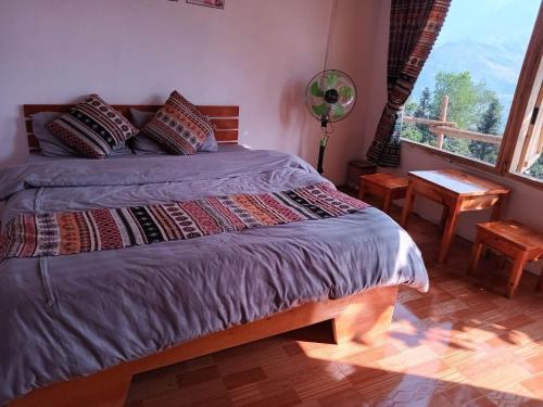 Katil atau katil-katil dalam bilik di Homestay Hoàng Vũ