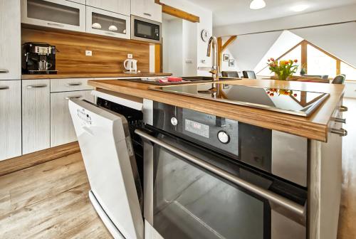 a kitchen with a sink and a dishwasher at Nice accommodation in Mikulov in Mikulov