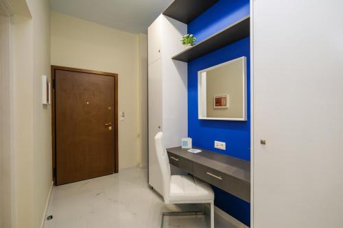 a bathroom with a desk and a blue wall at Piraeus 4th floor in Piraeus