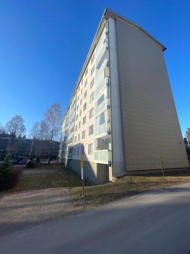 a large building with a large door on the side of it at Roomvantaa in Vantaa