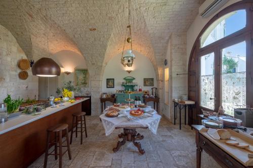 a kitchen with a table with food on it at Agriturismo Masseria Aprile in Locorotondo