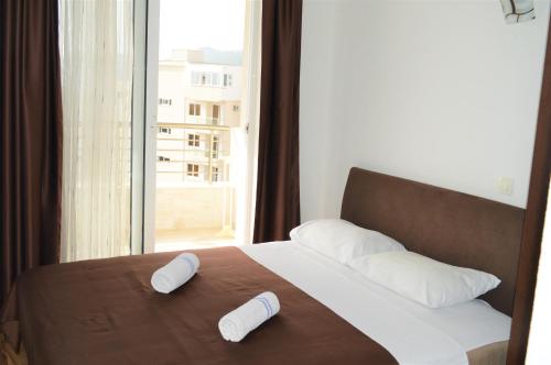 מיטה או מיטות בחדר ב-MS Hotel