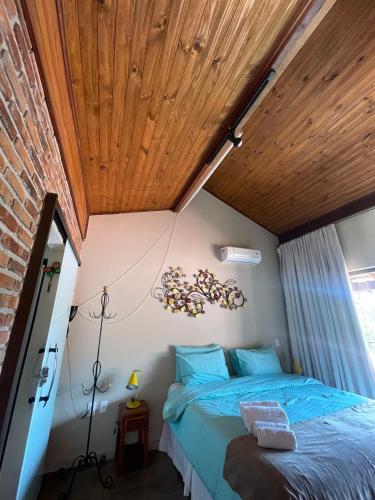 Ένα ή περισσότερα κρεβάτια σε δωμάτιο στο Pousada Verde Villas