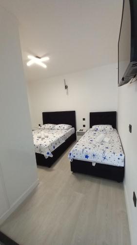 Katil atau katil-katil dalam bilik di Apartmani JaMi