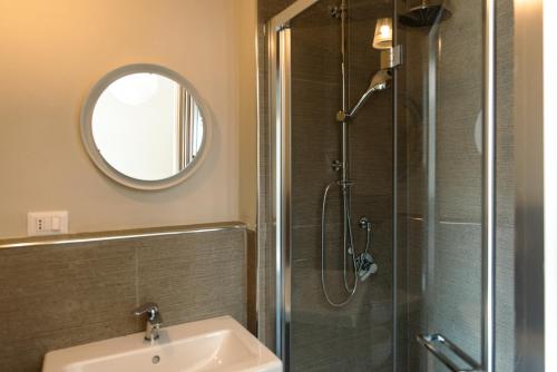 a bathroom with a sink and a shower with a mirror at Tenuta Mastro in Sulmona
