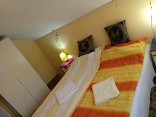Кровать или кровати в номере Vikendica Vidikovac na Zavojskom jezeru