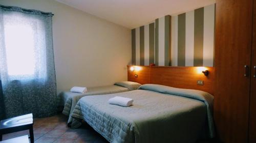 Postel nebo postele na pokoji v ubytování Hotel Piscina La Suite