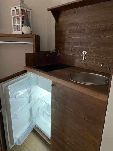 a bathroom with a sink and a counter with a drawer at La Goille Morgex in Morgex