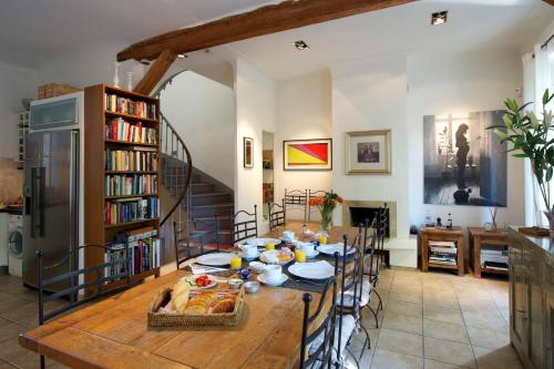 a dining room with a table with food on it at Rue Sade Bed & Breakfast in Antibes