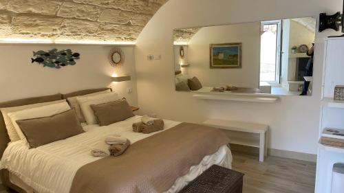 Letto o letti in una camera di Monolocale Dimora Borgo Monte nel cuore di Otranto con garage