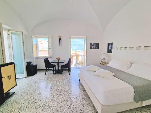 Postel nebo postele na pokoji v ubytování Roccobarocco Boutique Hotel